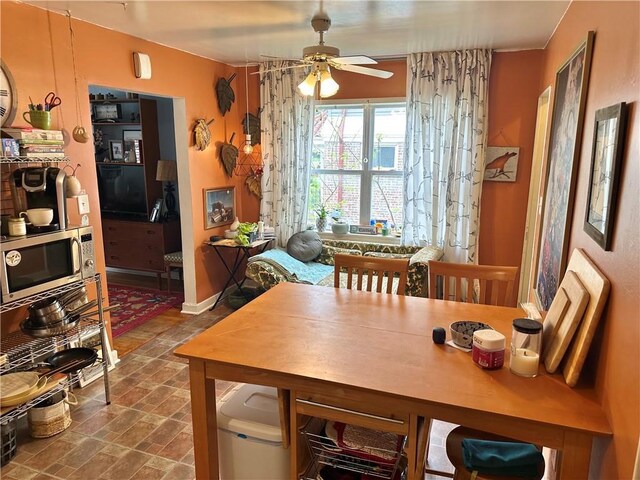 11305 E Winner Rd, Independence, MO 64052 - dining space featuring ceiling fan and baseboards