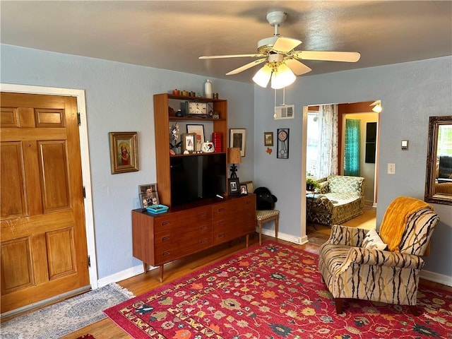 11305 E Winner Rd, Independence, MO 64052 - living area featuring light wood-style flooring, ceiling fan, and baseboards