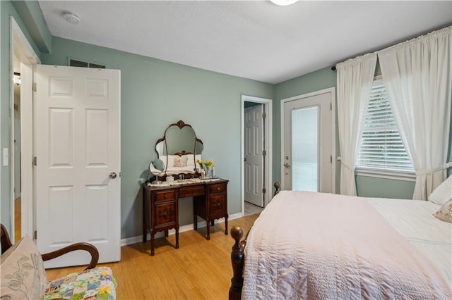 2113 N 155th St, Basehor, KS 66007 - bedroom with light wood-style flooring and baseboards