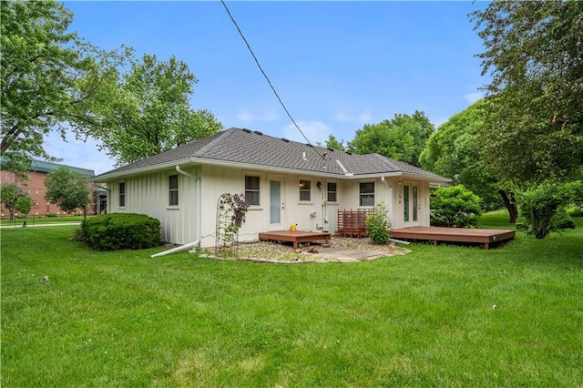 2113 N 155th St, Basehor, KS 66007 - rear view of property with a deck and a lawn