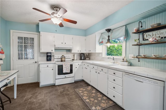 2113 N 155th St, Basehor, KS 66007 - kitchen with white appliances, a sink, under cabinet range hood, white cabinets, and ceiling fan
