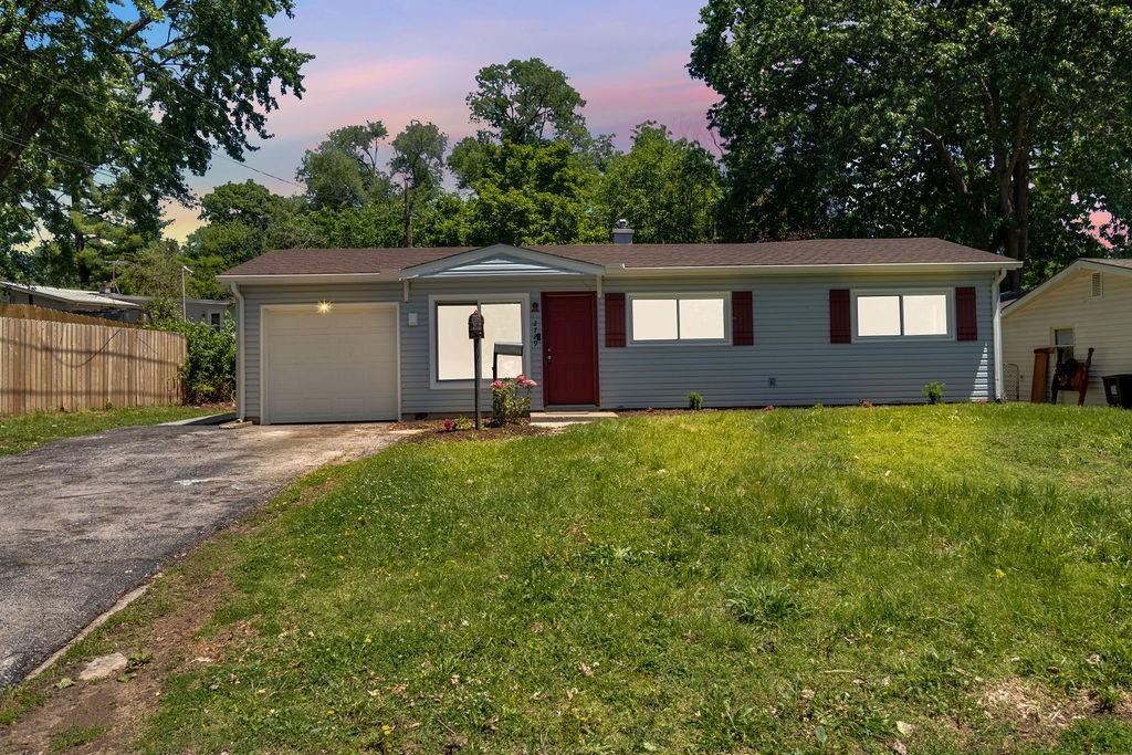 2729 S 52nd St, Kansas City, KS 66106 - ranch-style home featuring driveway and an attached garage