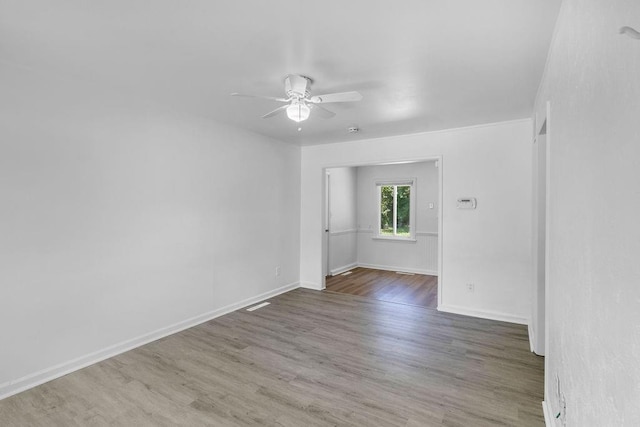 2729 S 52nd St, Kansas City, KS 66106 - unfurnished room with ceiling fan, wood finished floors, and baseboards