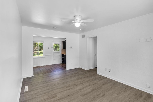2729 S 52nd St, Kansas City, KS 66106 - spare room with a ceiling fan, dark wood finished floors, and baseboards