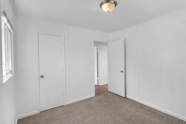 2729 S 52nd St, Kansas City, KS 66106 - unfurnished bedroom with carpet flooring and baseboards
