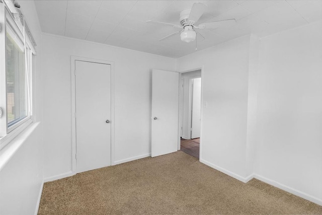 2729 S 52nd St, Kansas City, KS 66106 - unfurnished bedroom with carpet floors, ceiling fan, and baseboards