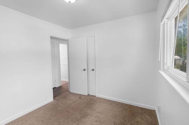 2729 S 52nd St, Kansas City, KS 66106 - spare room featuring carpet flooring and baseboards