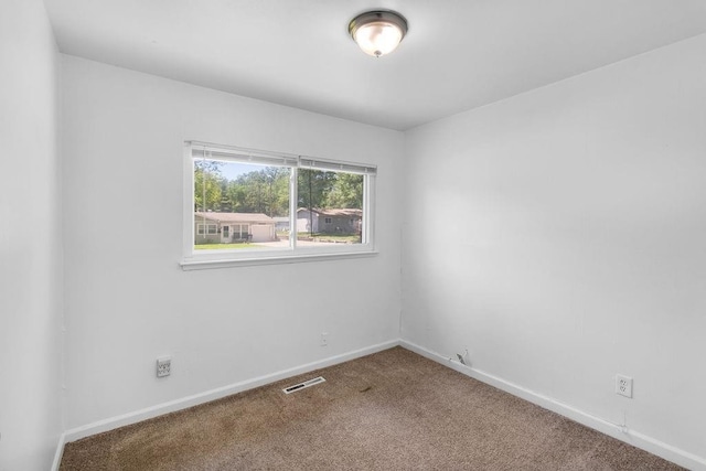 2729 S 52nd St, Kansas City, KS 66106 - carpeted spare room featuring baseboards