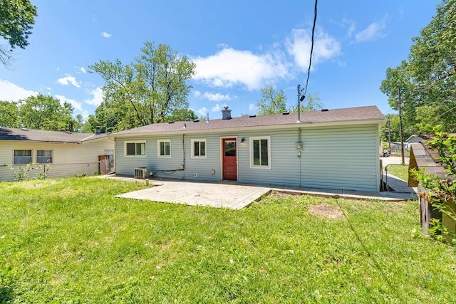 2729 S 52nd St, Kansas City, KS 66106 - back of house featuring a patio, cooling unit, and a chimney