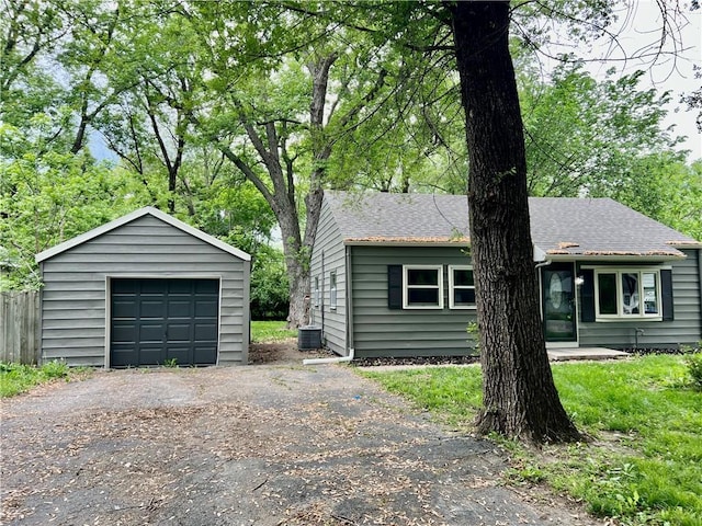 8416 Greenwood Rd, Raytown, MO 64138 - detached garage with asphalt driveway and central AC unit