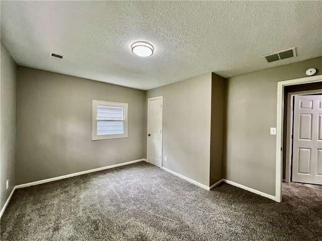 8416 Greenwood Rd, Raytown, MO 64138 - carpeted spare room with a textured ceiling, baseboards, and a smoke detector