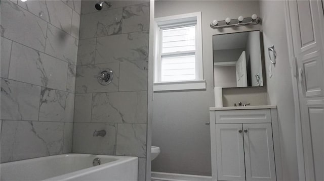 2243 Spruce Ave, Kansas City, MO 64127 - bathroom featuring toilet, vanity, and bathing tub / shower combination
