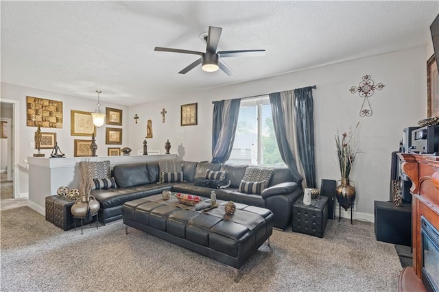 9504 E 89th St, Kansas City, MO 64138 - carpeted living area featuring a ceiling fan and a textured ceiling