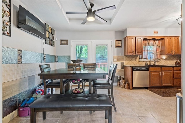 9504 E 89th St, Kansas City, MO 64138 - dining space featuring a ceiling fan, light tile patterned floors, and a tray ceiling