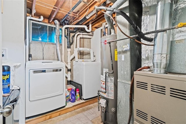 9504 E 89th St, Kansas City, MO 64138 - laundry room featuring gas water heater, washing machine and clothes dryer, and heating unit