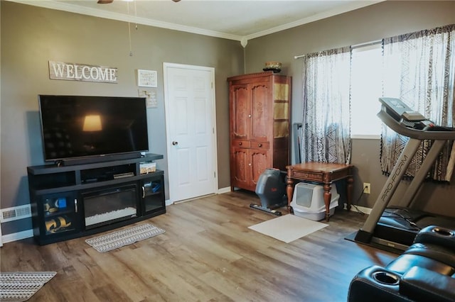 7164 State Route T Hwy, Amazonia, MO 64421 - living room with crown molding, wood finished floors, a ceiling fan, and baseboards