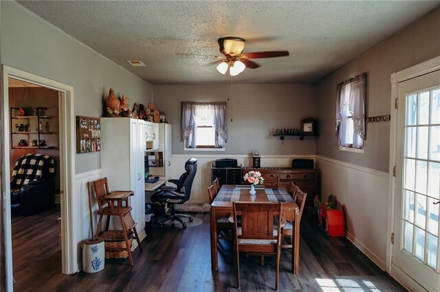 7164 State Route T Hwy, Amazonia, MO 64421 - dining space featuring a desk, a textured ceiling, dark wood-style floors, ceiling fan, and plenty of natural light