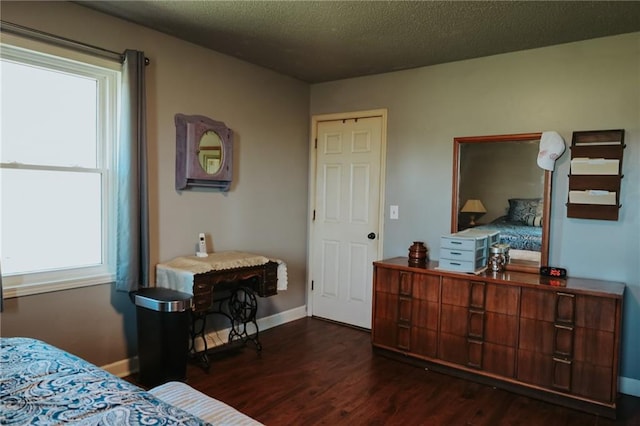 7164 State Route T Hwy, Amazonia, MO 64421 - bedroom with dark wood-style floors, baseboards, and a textured ceiling