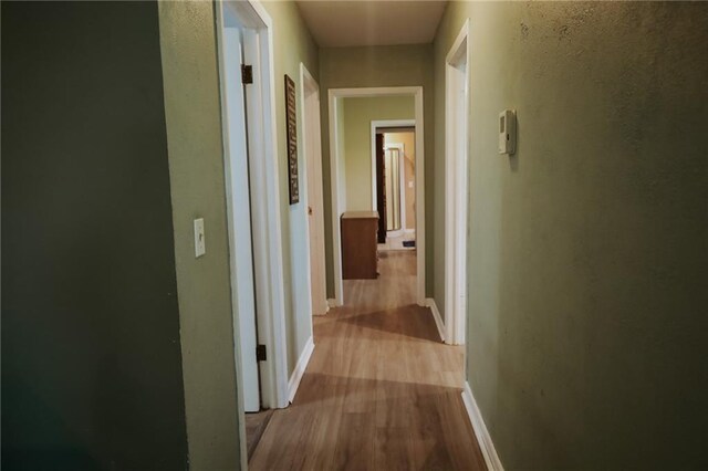 7166 State Route T Hwy, Amazonia, MO 64421 - hallway featuring wood finished floors and baseboards