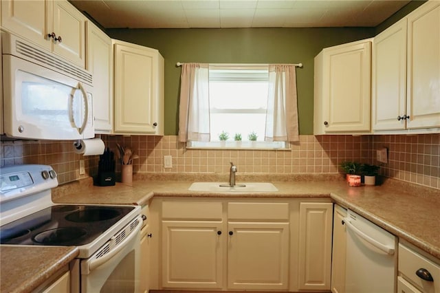 7166 State Route T Hwy, Amazonia, MO 64421 - kitchen with white appliances, decorative backsplash, white cabinets, and light countertops