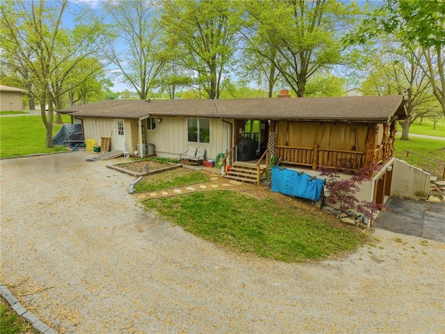 13813 Petty Rd, Kearney, MO 64060 - ranch-style house featuring a shingled roof, board and batten siding, a chimney, and a front lawn