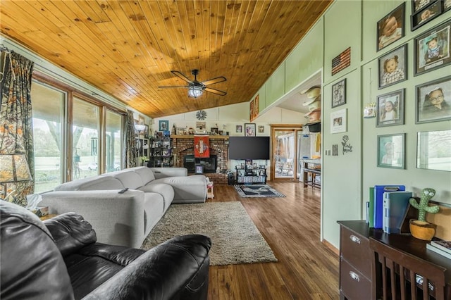13813 Petty Rd, Kearney, MO 64060 - living area featuring wooden ceiling, lofted ceiling, a ceiling fan, dark wood-type flooring, and a fireplace