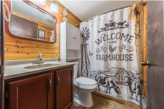13813 Petty Rd, Kearney, MO 64060 - bathroom featuring wood walls, vanity, toilet, and curtained shower