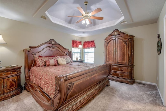 748 SW Windsong Cir, Lees Summit, MO 64082 - bedroom with light colored carpet, a raised ceiling, and ceiling fan