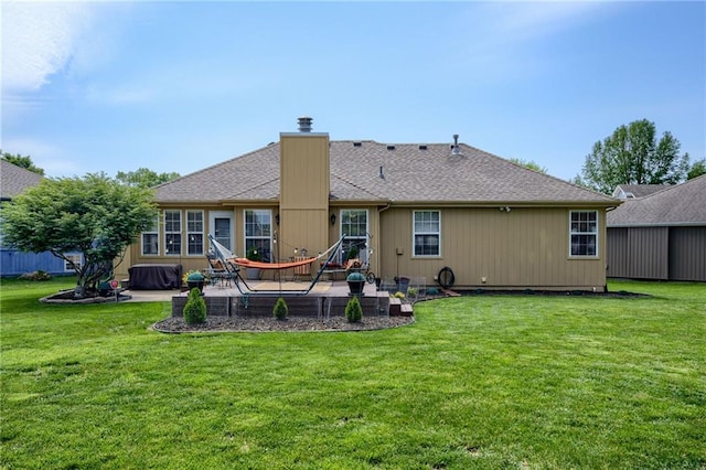 748 SW Windsong Cir, Lees Summit, MO 64082 - back of property with a patio, a chimney, a yard, and roof with shingles