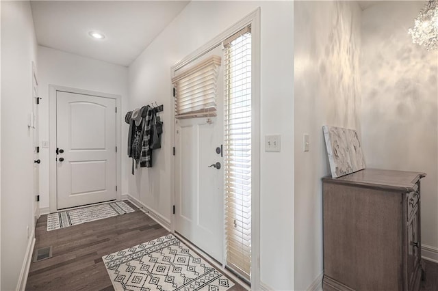 doorway featuring wood finished floors, baseboards, a chandelier, and recessed lighting