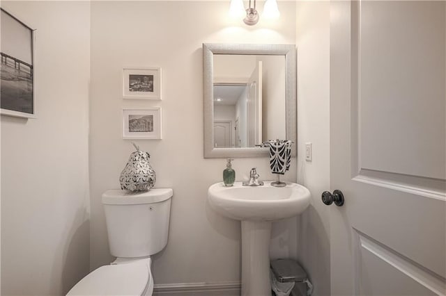 bathroom featuring toilet and a sink
