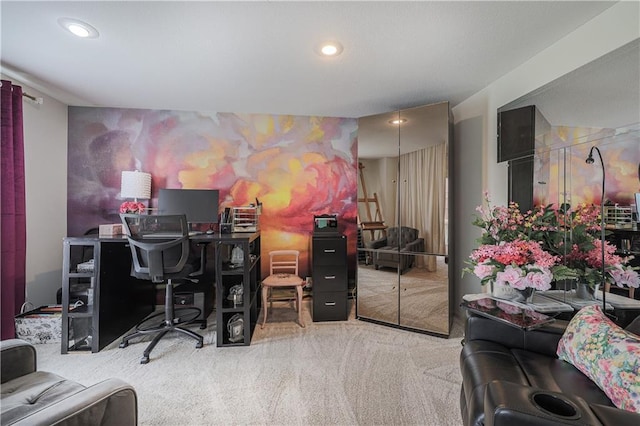 carpeted office with an accent wall and recessed lighting