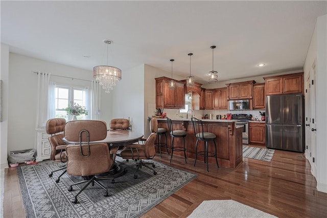 dining area with a chandelier, plenty of natural light, light wood-style flooring, and recessed lighting