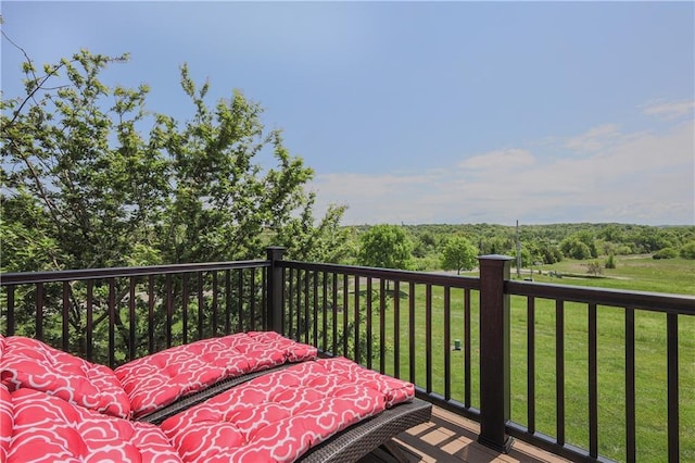 deck featuring a lawn