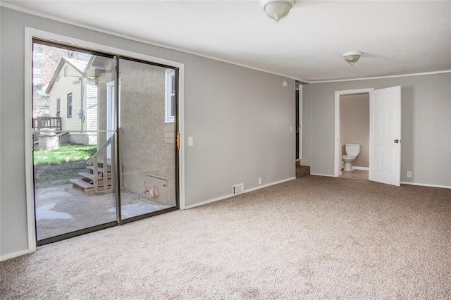 110 S Park Ave, Independence, MO 64050 - spare room featuring crown molding, carpet flooring, and baseboards