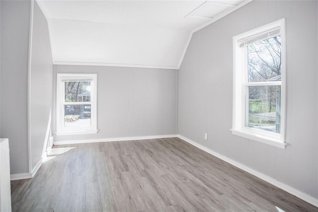 110 S Park Ave, Independence, MO 64050 - bonus room with wood finished floors, healthy amount of natural light, lofted ceiling, attic access, and baseboards
