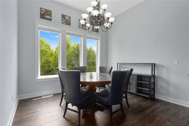 28897 Hackberry Cir, Paola, KS 66071 - dining area featuring healthy amount of natural light, a chandelier, and wood finished floors