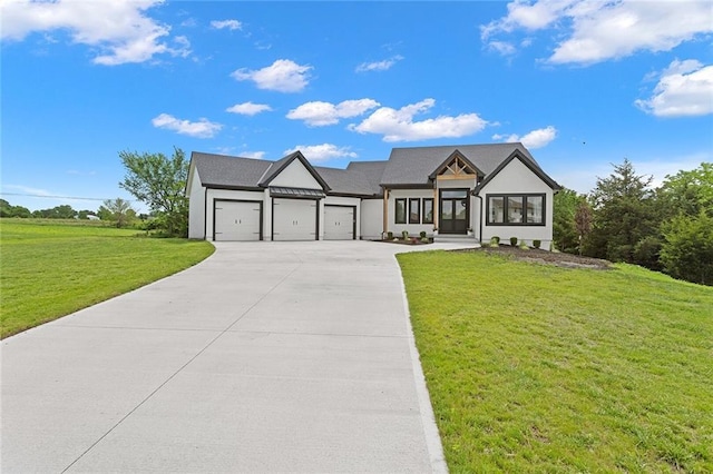 28897 Hackberry Cir, Paola, KS 66071 - modern inspired farmhouse featuring a garage, driveway, a front lawn, and stucco siding