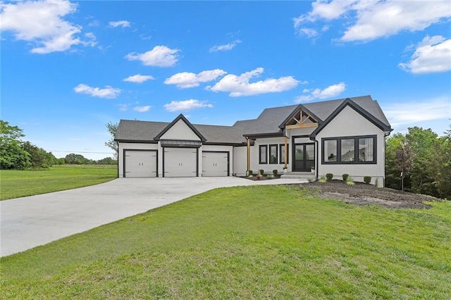 28897 Hackberry Cir, Paola, KS 66071 - modern farmhouse with an attached garage, driveway, a front lawn, and stucco siding