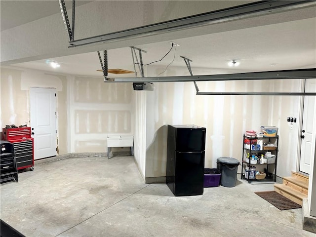 28897 Hackberry Cir, Paola, KS 66071 - garage featuring freestanding refrigerator