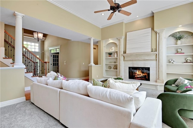 6330 N Nevada Ave, Parkville, MO 64152 - living area featuring ornate columns, baseboards, a ceiling fan, ornamental molding, and carpet floors
