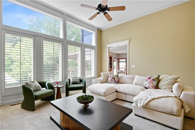 6330 N Nevada Ave, Parkville, MO 64152 - living area with a ceiling fan, crown molding, carpet, and plenty of natural light