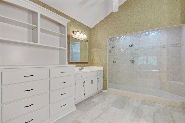6330 N Nevada Ave, Parkville, MO 64152 - bathroom featuring vaulted ceiling, vanity, and a walk in shower
