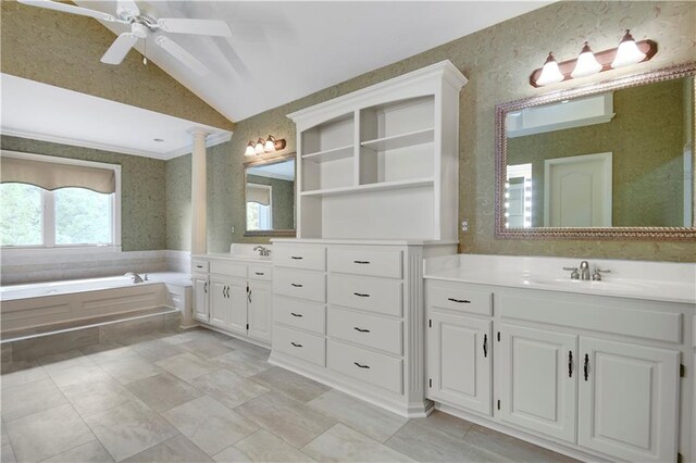 6330 N Nevada Ave, Parkville, MO 64152 - bathroom with lofted ceiling, two vanities, ceiling fan, wallpapered walls, and a garden tub