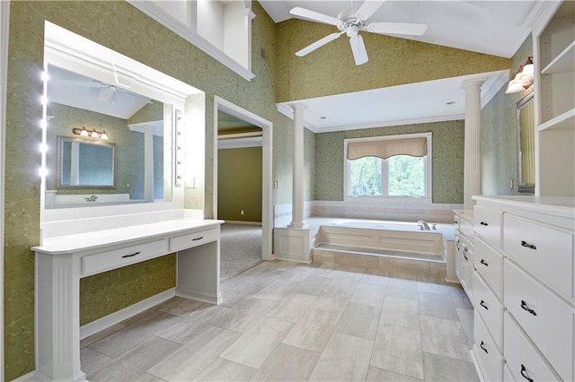 6330 N Nevada Ave, Parkville, MO 64152 - bathroom with ornate columns, vaulted ceiling, vanity, a bath, and ceiling fan