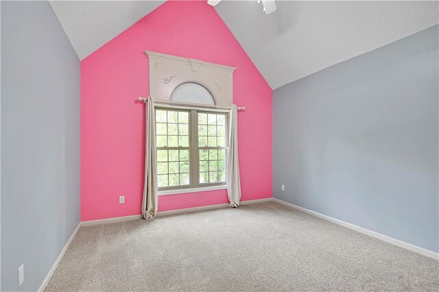 6330 N Nevada Ave, Parkville, MO 64152 - carpeted empty room with lofted ceiling, a ceiling fan, and baseboards