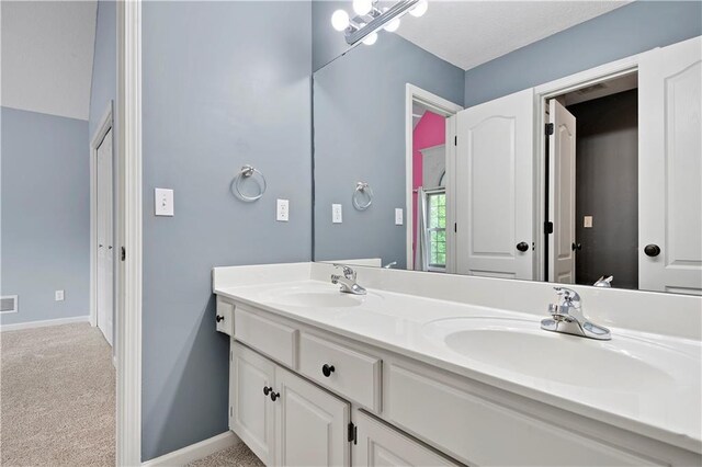 6330 N Nevada Ave, Parkville, MO 64152 - full bathroom featuring double vanity and baseboards