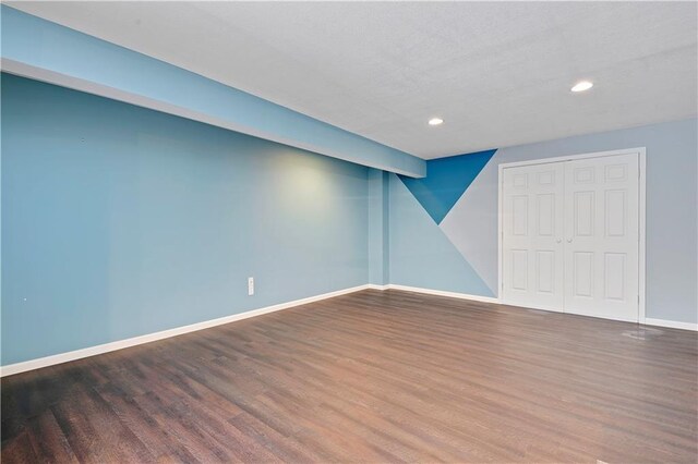 6330 N Nevada Ave, Parkville, MO 64152 - below grade area featuring wood finished floors, baseboards, and recessed lighting