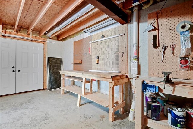 6330 N Nevada Ave, Parkville, MO 64152 - unfinished basement featuring a workshop area