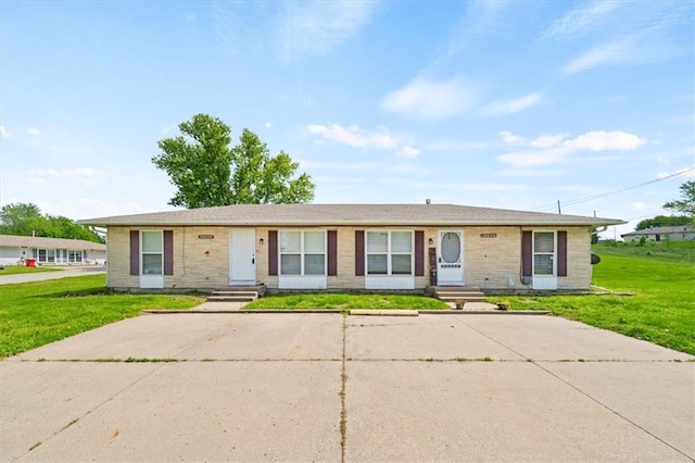 18828-30 E Wigwam Pl, Independence, MO 64056 - ranch-style home with a front lawn, entry steps, and uncovered parking